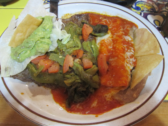 Tampiqueña traditionally includes a steak with an enchilada